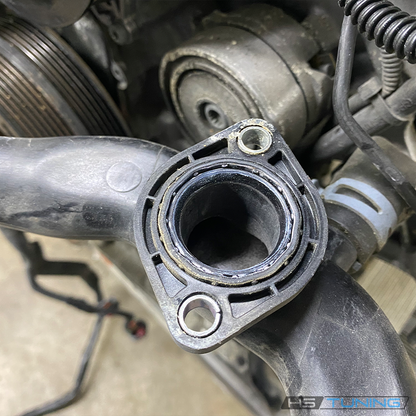 Coolant-pipe joint service context for 06E-121-119-K seal; pipe not included, source photo 3