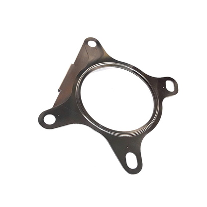 Genuine VW/Audi 1K0-253-115-AB turbocharger outlet exhaust gasket showing central seal and four attachment openings; repeated source photo 7