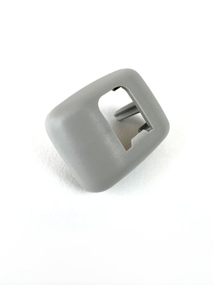 Genuine VW/Audi 8E0-857-563-A-1YE silver sun visor bracket cover showing textured surface and holder opening