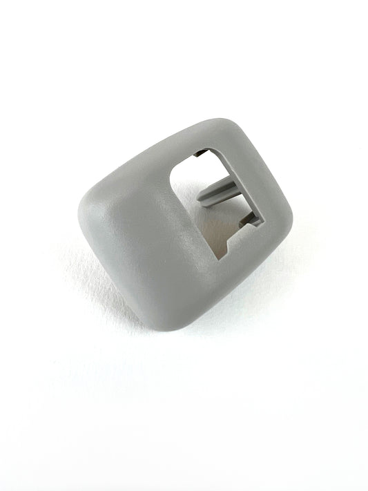 Genuine VW/Audi 8E0-857-563-A-1YE silver sun visor bracket cover showing textured surface and holder opening
