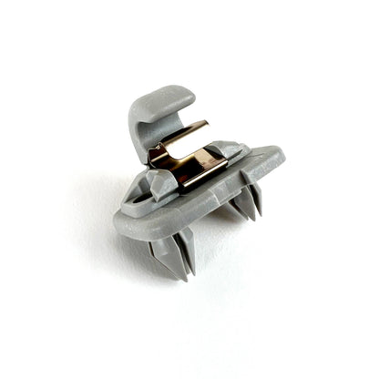 Genuine VW/Audi 8W0-857-562-A-1YE silver sun visor retaining clip showing molded holder, metal retaining element and mounting features; repeated source photo 6
