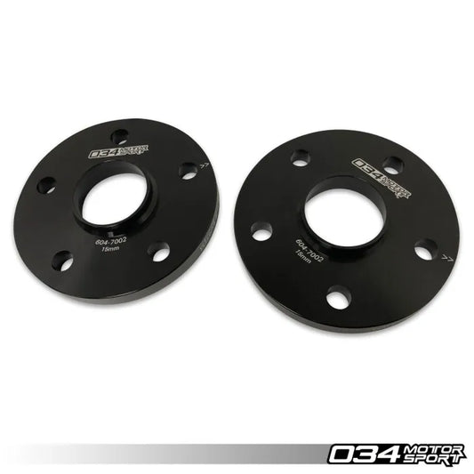 Two black wheel spacers with '034 Motorsport' branding on a white background.