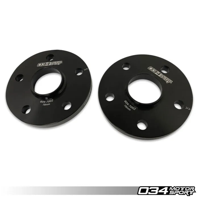 Two black wheel spacers with '034 Motorsport' branding on a white background.