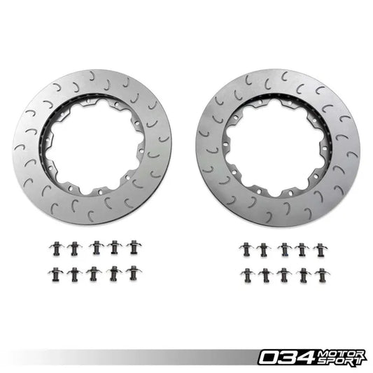 Two metallic brake rotors with small icons and '034 Motor Sport' branding on a white background.