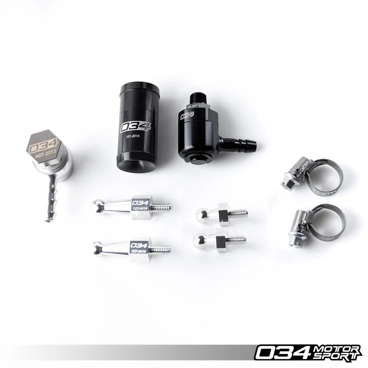 HS Tuning 034Motorsport catch can kit components including black billet aluminum catch can, check valves, and hardware.
