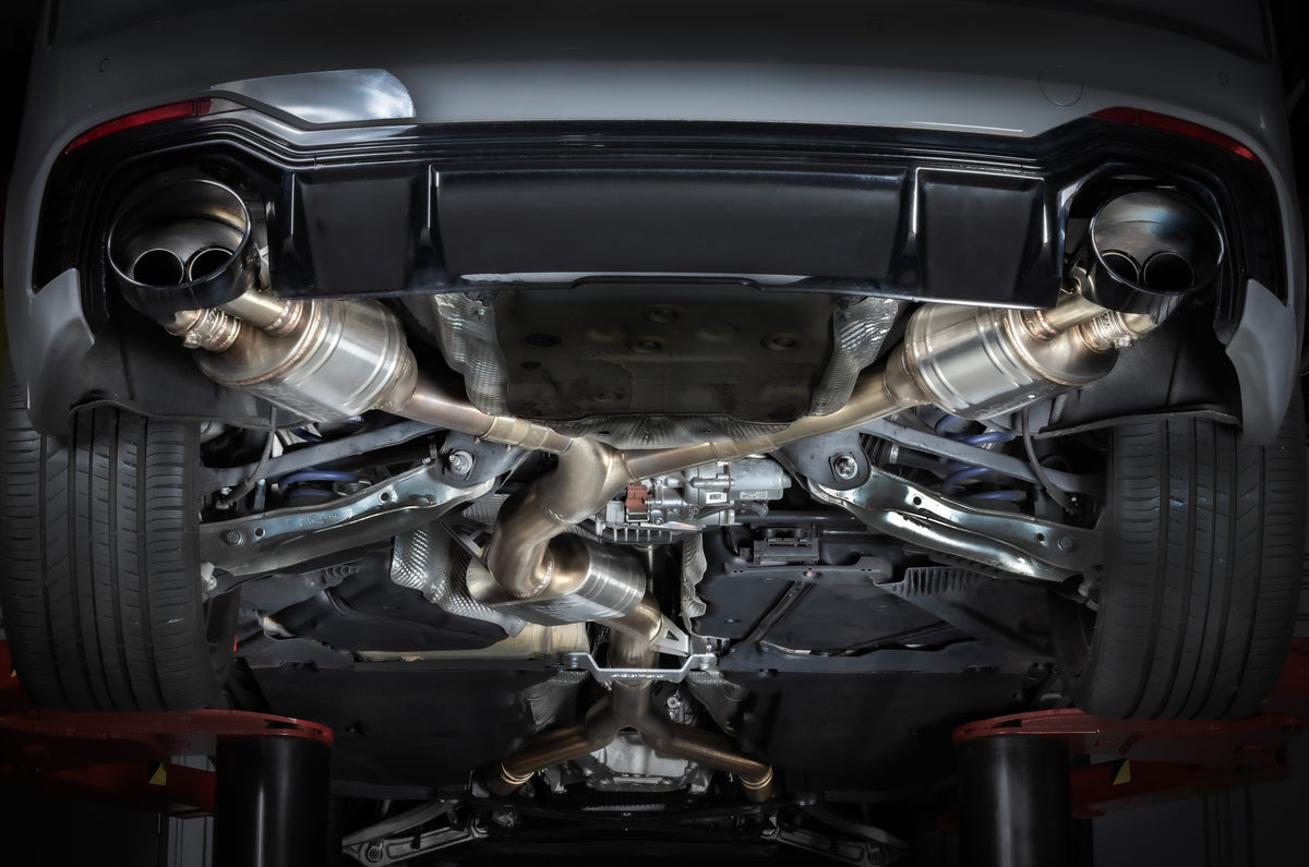 Close-up view of a car's exhaust system under the vehicle. hs tuning apr rs4 and rs5 b9 exhaust