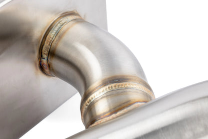 Close-up of HS Tuning APR stainless steel exhaust pipe showing high-quality TIG welding and brushed metal finish.