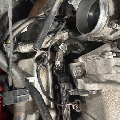 HS Tuning Jackal Motorsports Audi CREC MPI fueling upgrade kit installed in an engine bay with durable fuel lines.