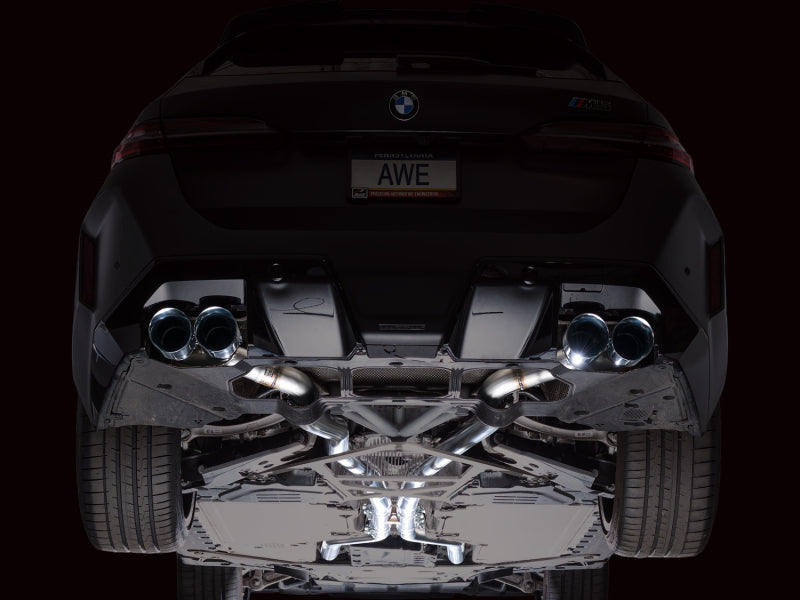 HS Tuning AWE Tuning Track Edition cat-back exhaust with chrome silver tips installed on a BMW M5 rear undercarriage