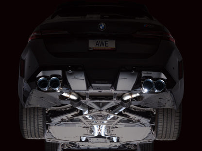 HS Tuning AWE Tuning Track Edition cat-back exhaust with chrome silver tips installed on a BMW M5 rear undercarriage