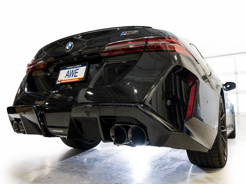 HS Tuning AWE Tuning Track Edition cat-back exhaust with diamond black tips installed on a black BMW M5 rear