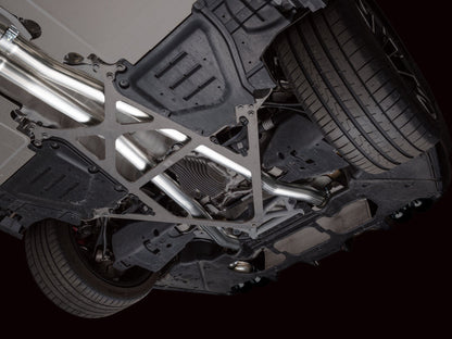 HS Tuning AWE Tuning Track Edition cat-back exhaust system installed under a BMW M5, showing stainless steel piping.