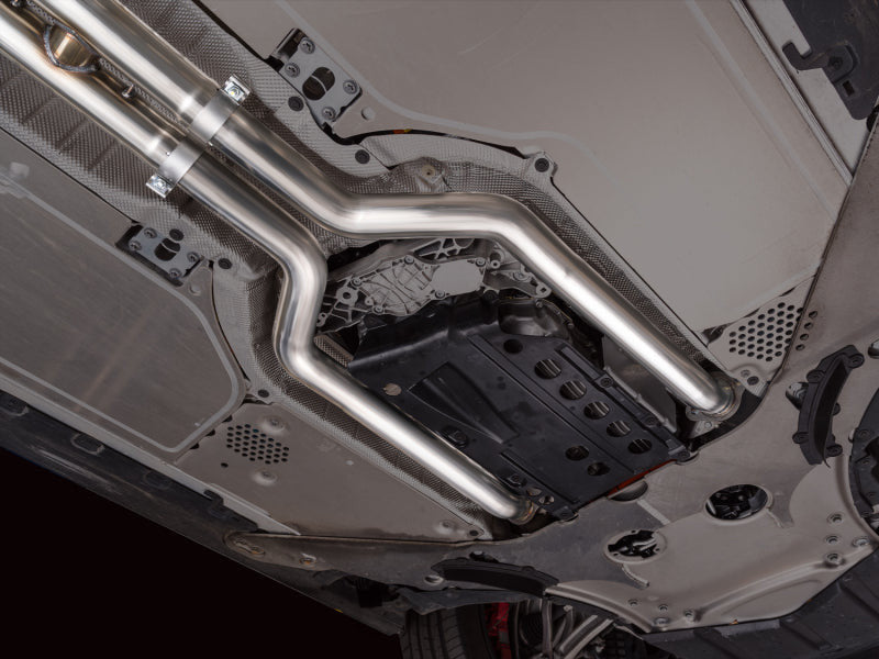 HS Tuning AWE Tuning BMW M5 Track Edition cat-back exhaust system installed under the vehicle chassis.