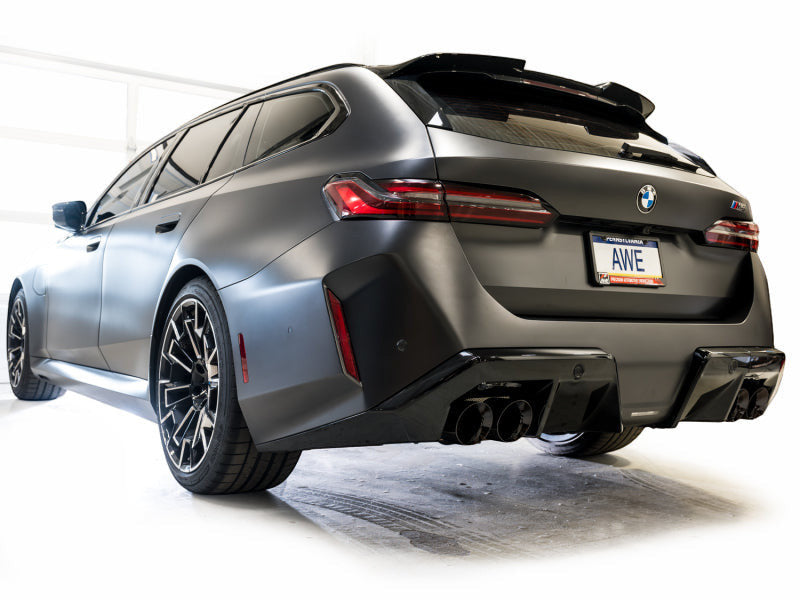 HS Tuning AWE Tuning Track Edition exhaust with diamond black tips installed on a matte grey BMW M5 Touring