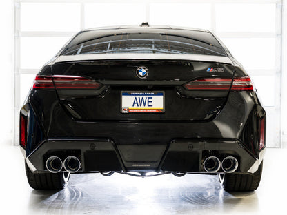 HS Tuning AWE Tuning Track Edition cat-back exhaust with chrome silver tips on a black BMW M5 rear view