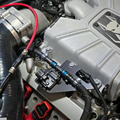 HS Tuning Jackal Motorsports ethanol sensor bracket installed on an Audi 3.0TFSI engine bay with fuel lines