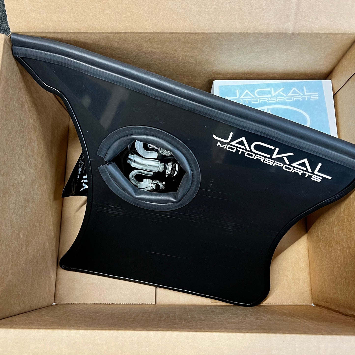 HS Tuning Jackal Motorsports black heat shield for B6/B7 S4 air intake system inside a shipping box
