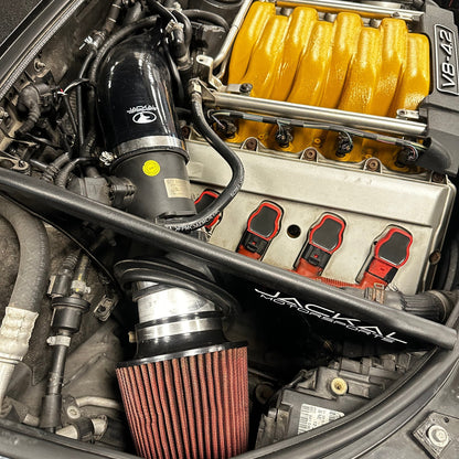 HS Tuning Jackal Motorsports air intake system installed in an Audi B6/B7 S4 engine bay with a yellow intake manifold.
