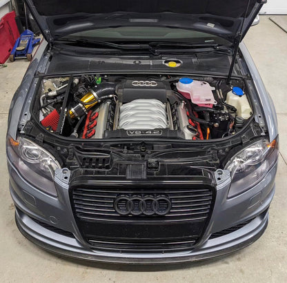 HS Tuning Jackal Motorsports air intake system installed in an Audi B6/B7 S4 engine bay with a red filter.