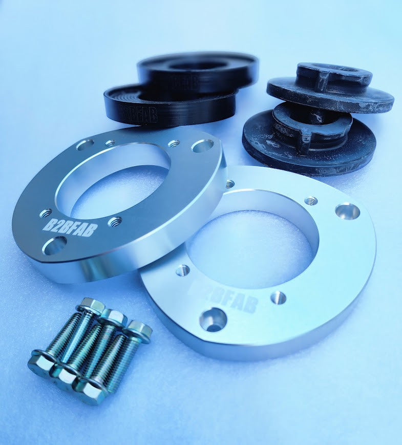 HS Tuning B2BFAB 0.75-inch mild lift kit for MQB vehicles with aluminum front spacers, HDPE rear spacers, and bolts.