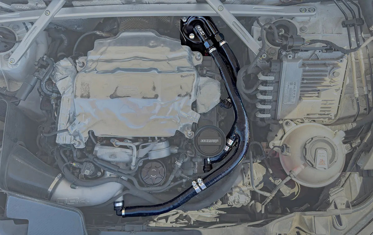 HS Tuning 034Motorsport catch can kit installed in an Audi engine bay with black billet aluminum and silicone hoses.