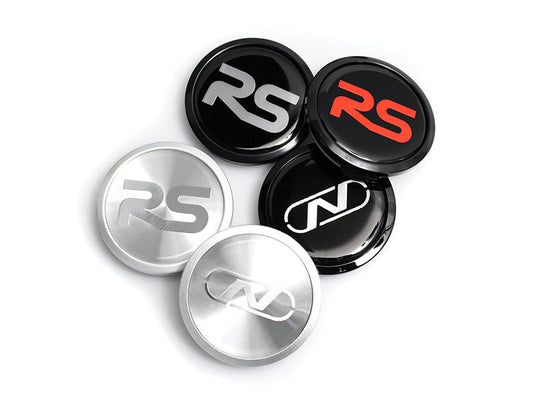 Set of car emblem stickers with 'RS' and other logos on a white background